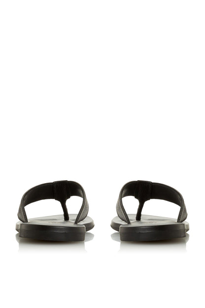 Black slide sandal pair, open toe with textured straps and flat rubber footbed