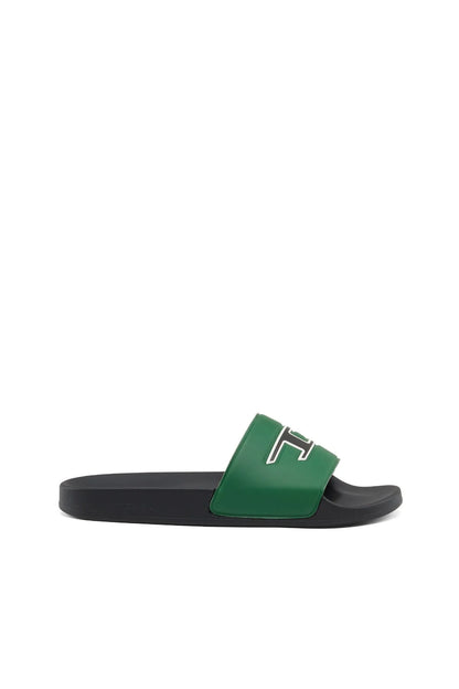 Green slide sandal with black sole and white logo patch on the upper