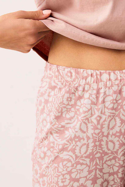 Pink patterned lounge pants with elastic waistband and gathered cuffs