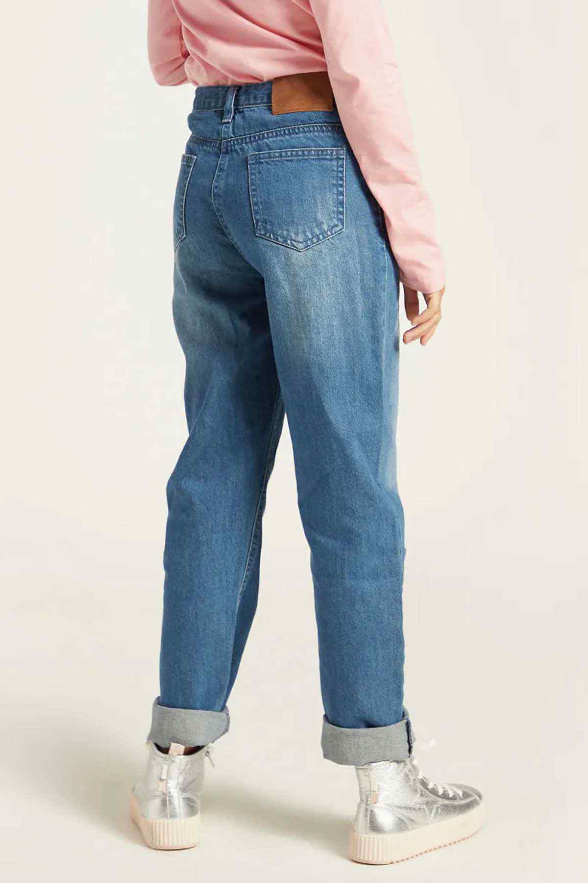 Light-blue denim jeans with mid-rise waist, front pockets, and rolled cuff