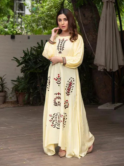 Pale yellow embroidered long dress with round neckline and balloon sleeves, front panel print