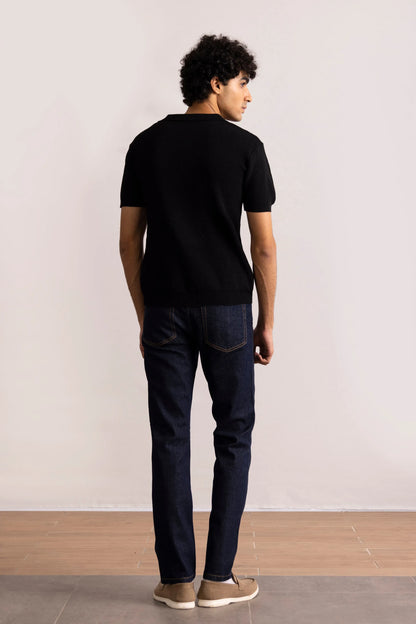 Black polo shirt back view with short sleeves and ribbed knit texture
