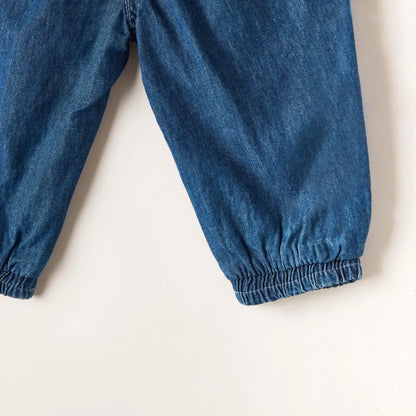 Blue denim baby pants with elastic cuffs and relaxed tapered legs