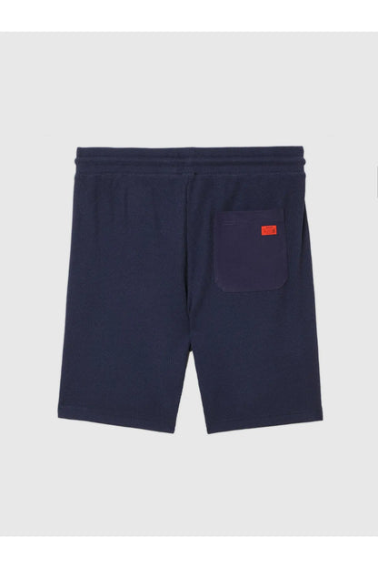 Navy Diesel shorts with elastic waistband, side pocket, and orange tag
