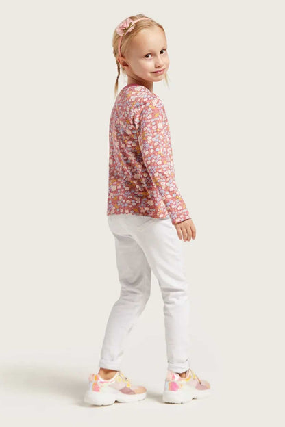 BABYSHOP floral long-sleeve shirt with white pants, side view