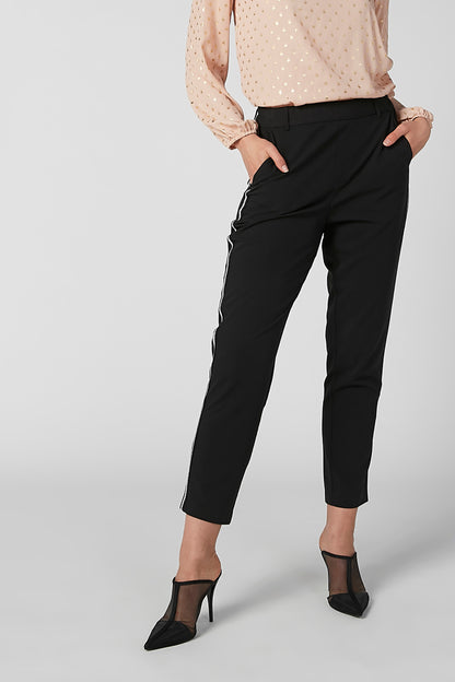 Black tapered ankle pants close-up, belt loops and side pockets