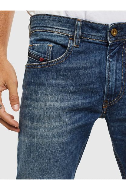 Diesel blue denim jeans front close-up: button waist, curved pocket seams