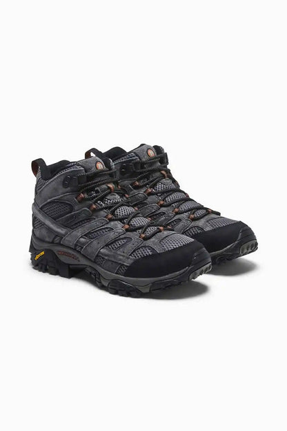 Black lace-up hiking shoe with textured overlays and orange lace accents