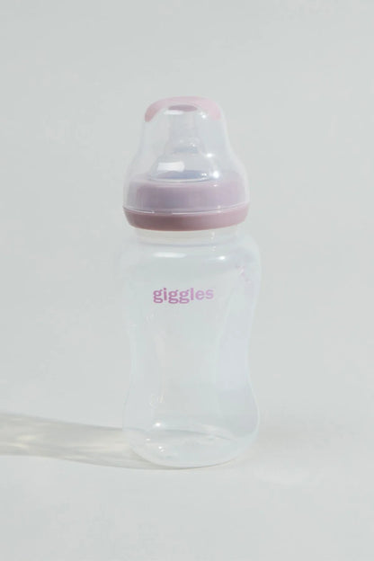 Clear baby bottle with pink lid and 'giggles' print, standing upright