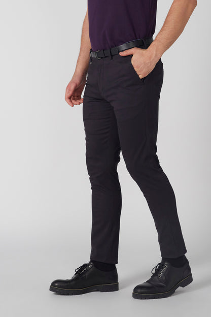 Black trousers with belt, black lace-up shoes, full lower-body view