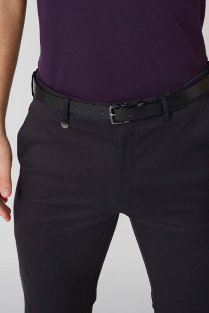 Black trousers with leather belt and buckle, front waist close-up