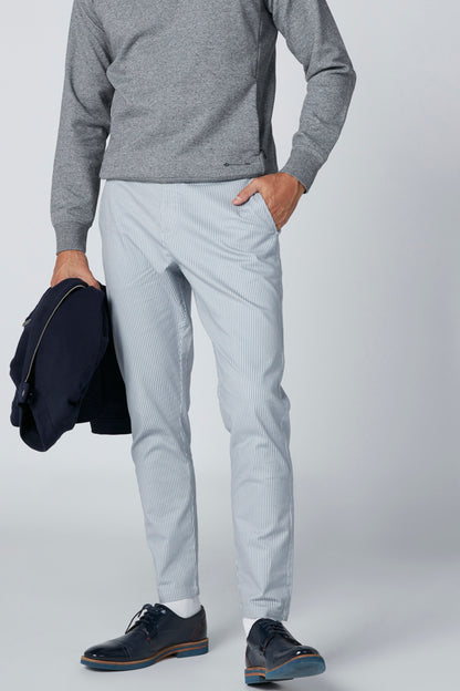 Men's heather gray long-sleeve top with light blue slim trousers, side pocket