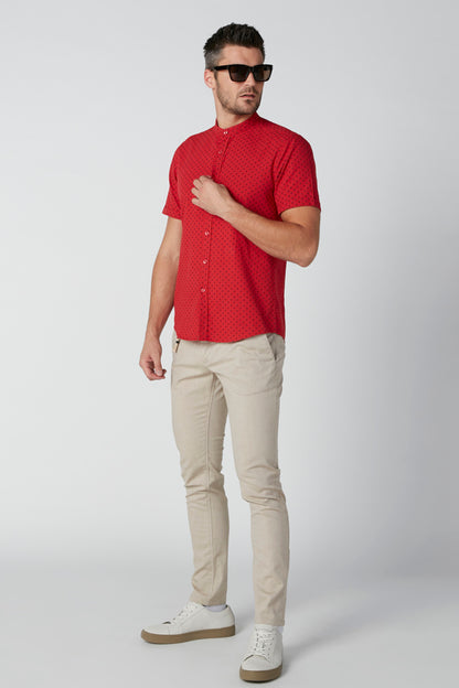 Beige men's slim-fit pants with belt loops, front pockets, and tapered legs