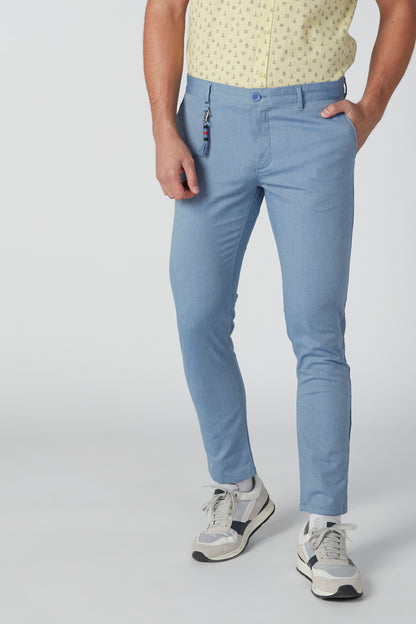 Light blue jeans with belt loops, zip fly, and front pockets
