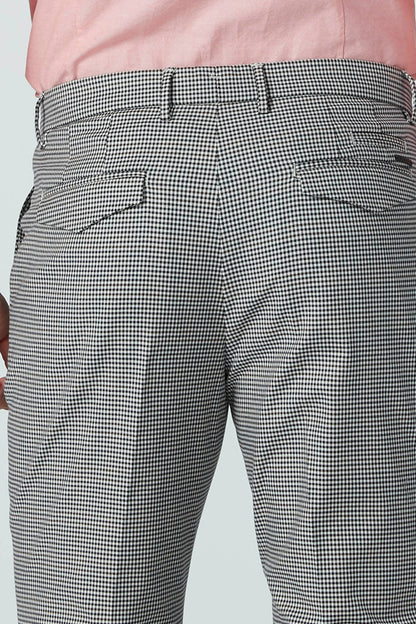 Men's gray-and-white checkered pants with flat front, belt loops, and side pockets