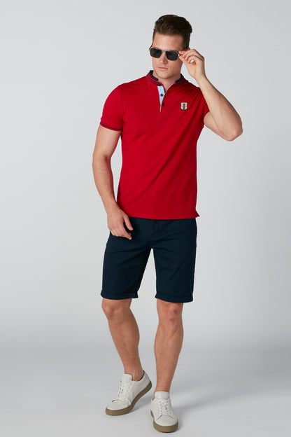 Navy knee-length shorts with side pockets, model front view