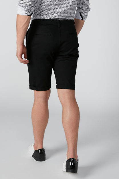 Black knee-length shorts, back view with belt loops and straight hem