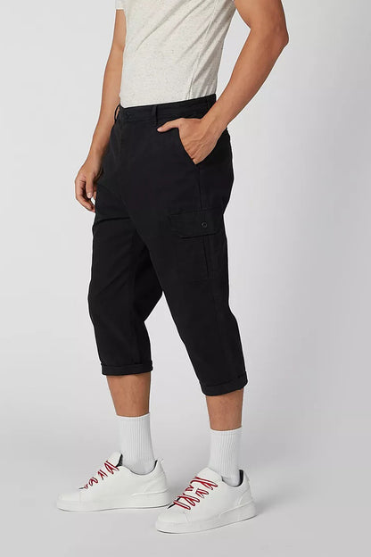 Black cargo shorts with hand-in-pocket detail and cuffed 3/4 length hem