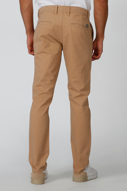 Men's brown chino pants with back pockets, belt loops, and tapered straight legs