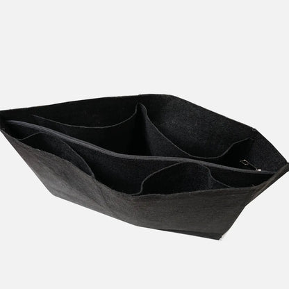 Black felt organizer tray with multiple interior compartments and metal clasp