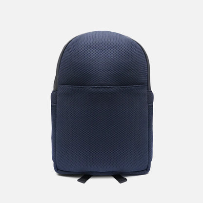 Navy textured mini backpack with curved top and front flap pocket, adjustable straps