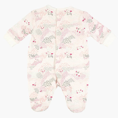 Pink-and-white baby sleepsuit with allover cloud, house, and tree print, footed