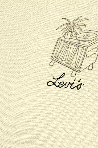 Light yellow T-shirt close-up of record-player graphic and script