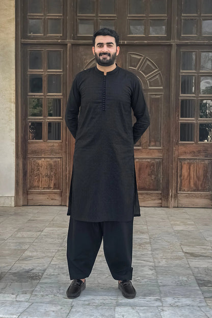 Men's black kurta and shalwar set, long sleeves, button placket