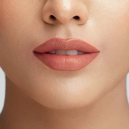 Close-up lips with rose lipstick, smooth glossy finish.