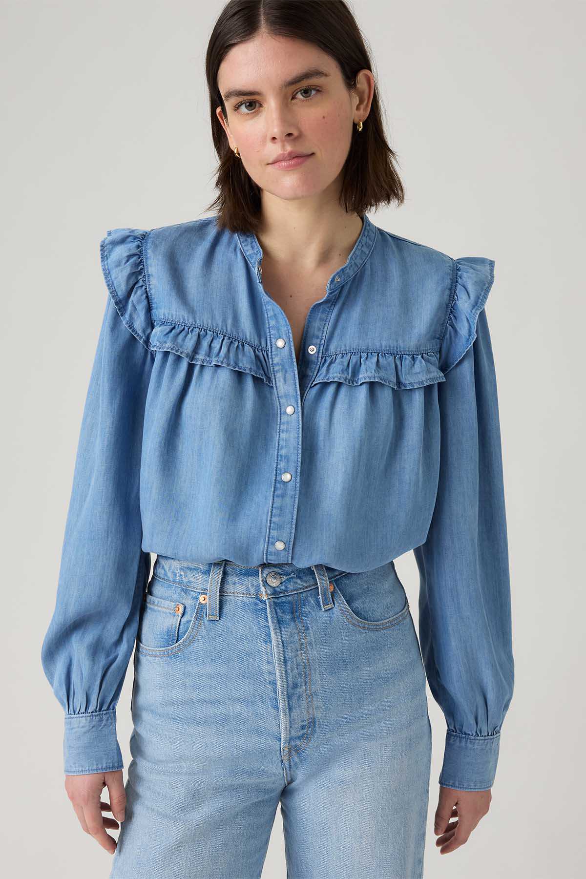 Levi's light blue denim button-front blouse with ruffled yoke and long sleeves