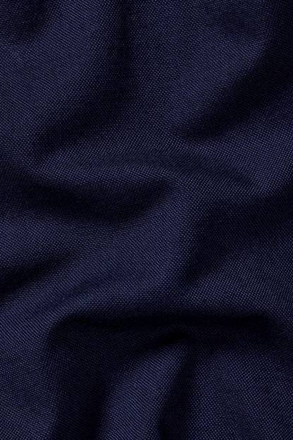 Dark blue dress shirt fabric close-up with fine woven texture