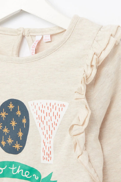 Cream baby top close-up with ruffled crew neck and partial world print