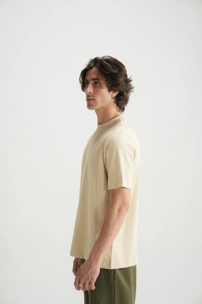 Beige short-sleeve crewneck T-shirt side view on male model
