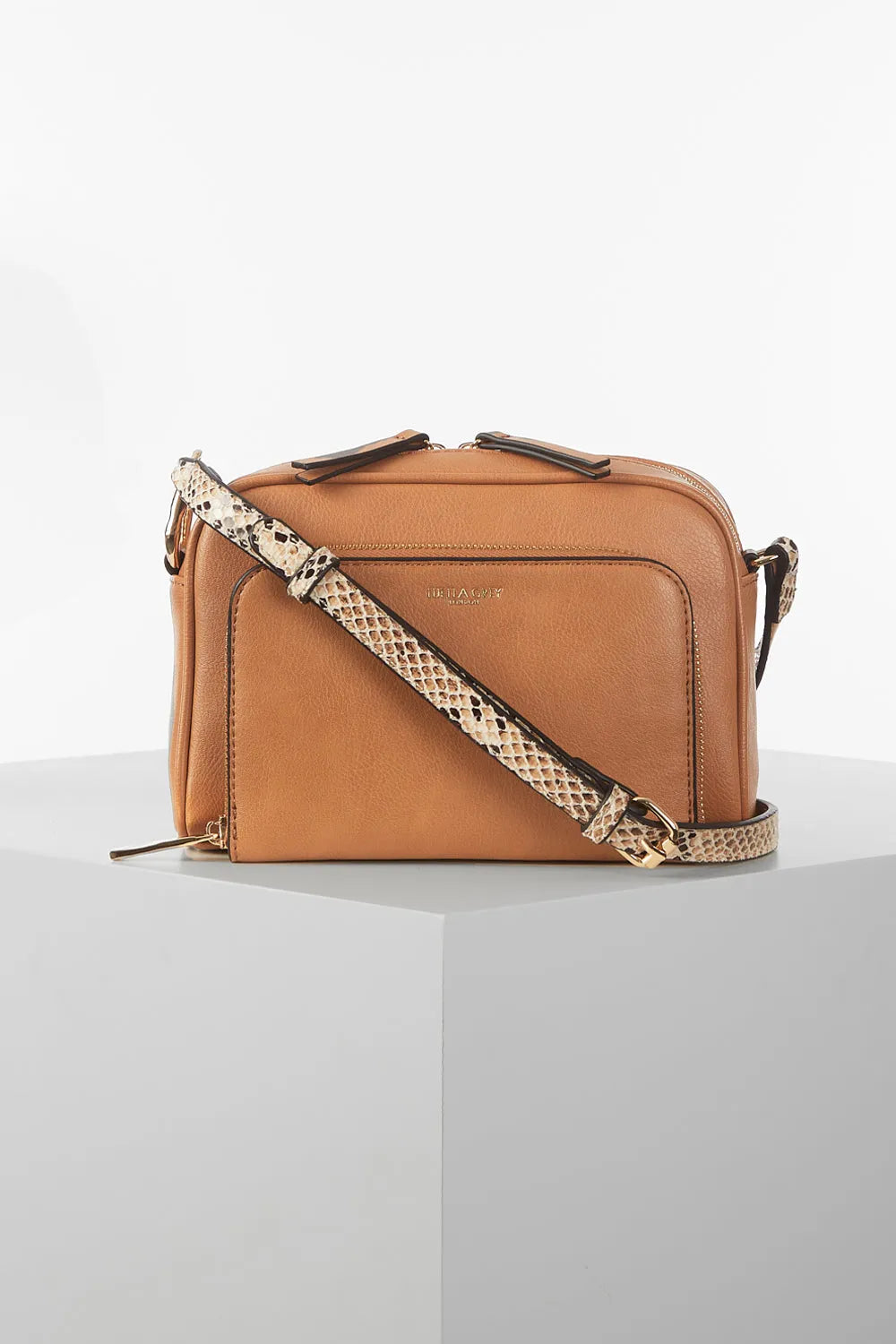 Brown leather crossbody bag with front zip pocket and snakeskin print strap