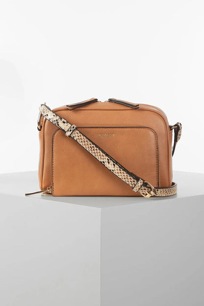 Brown leather crossbody bag with front zip pocket and snakeskin print strap