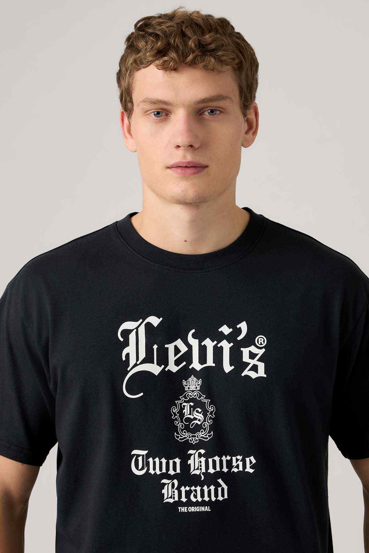 Black T-shirt close-up with Levi's Two Horse Brand crest logo