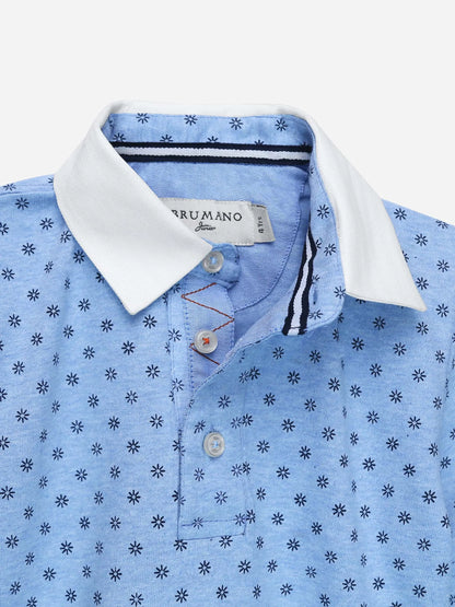 Blue polo shirt close-up: white collar, button placket, repeating dot pattern