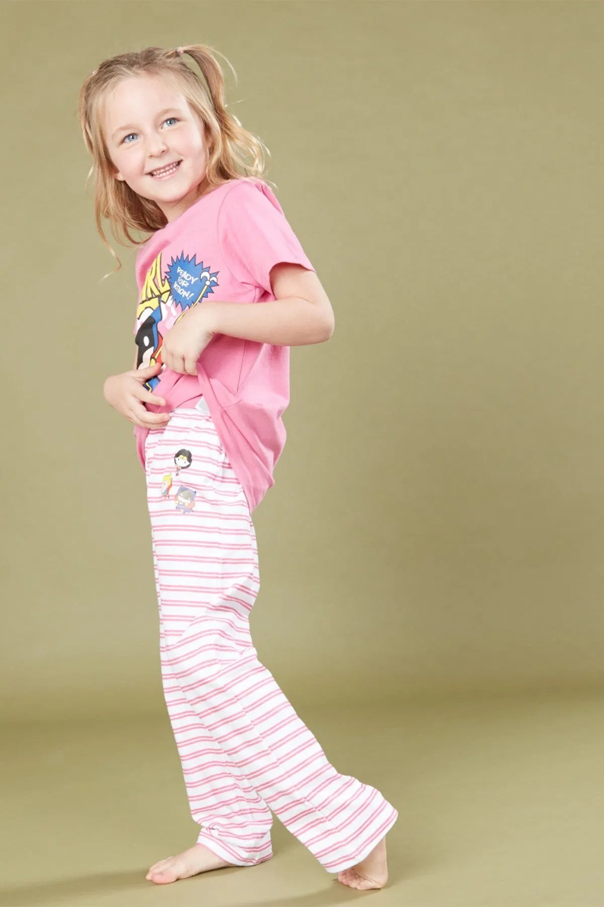 Kids pink pajama set, front view: graphic tee and pink-and-white striped pajama pants