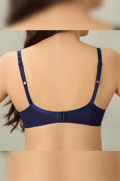 Back view of navy blue patterned bra with adjustable straps and hook closure