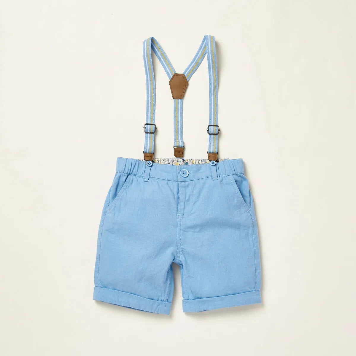 Baby light blue shorts with suspenders and patterned short-sleeve shirt, front view
