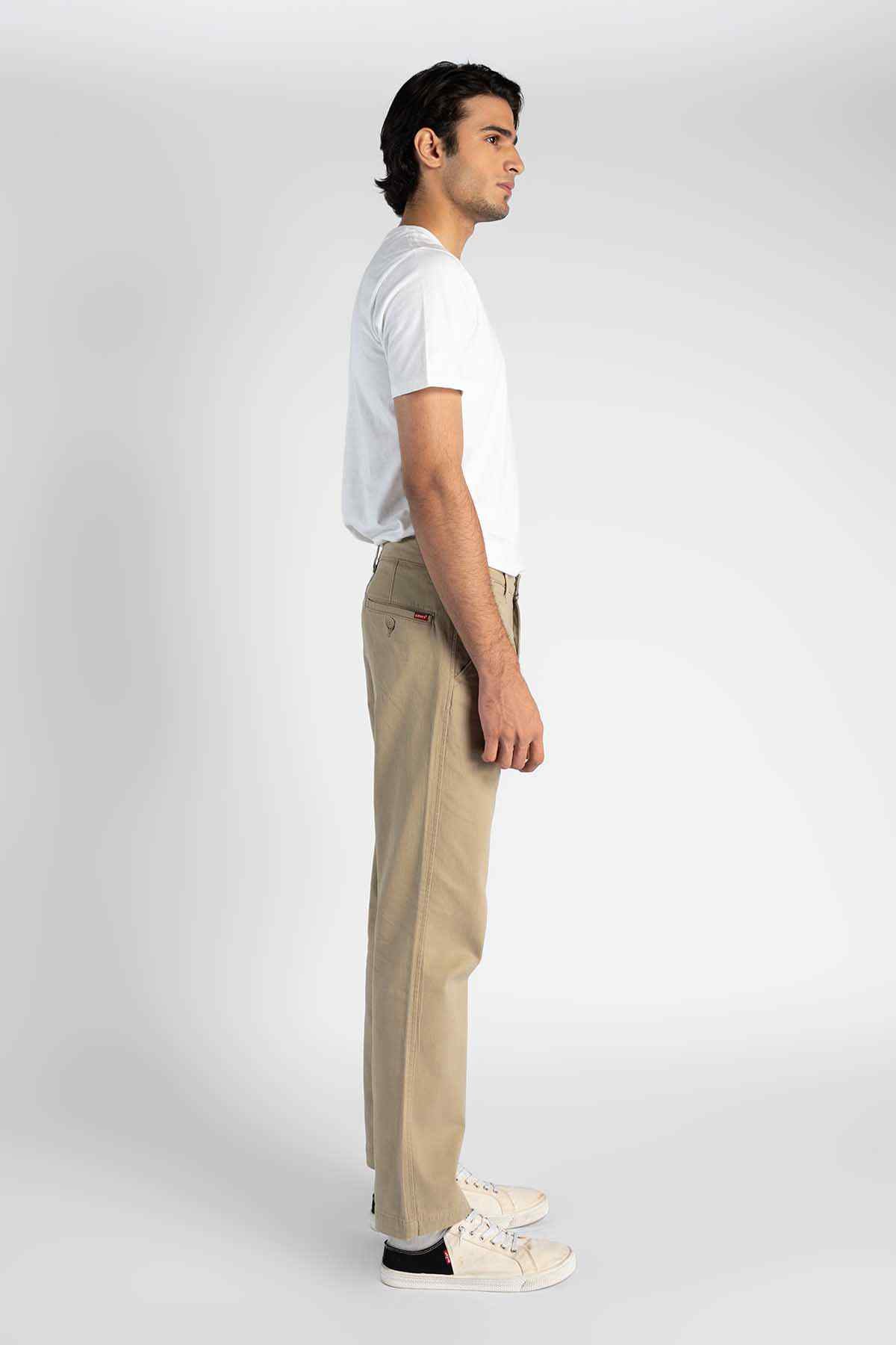 Khaki straight-leg pants with side seam and belt loops, profile view