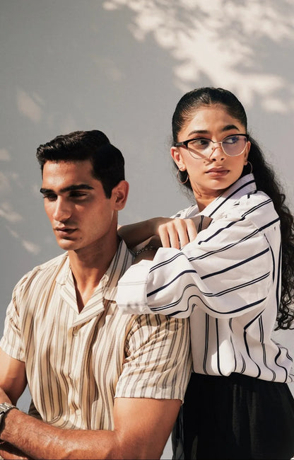 Brackets striped short-sleeve shirt in beige, worn by model over dark bottoms