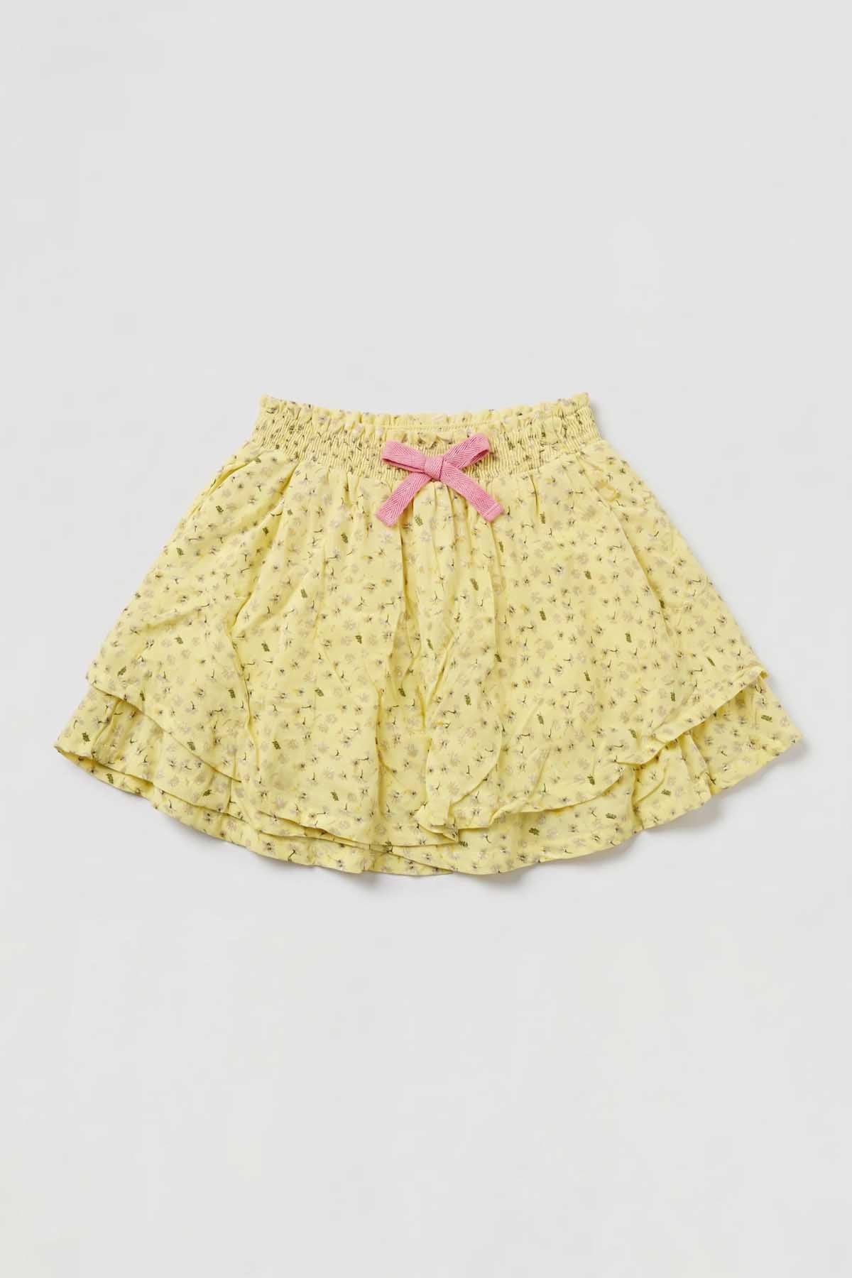 Yellow baby skirt with pink ribbon bow at waist, layered ruffled hem
