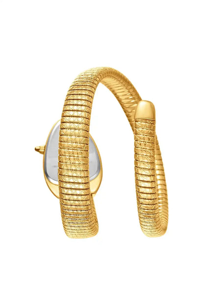 Gold wristwatch side view with teal dial window and coiled mesh bracelet strap