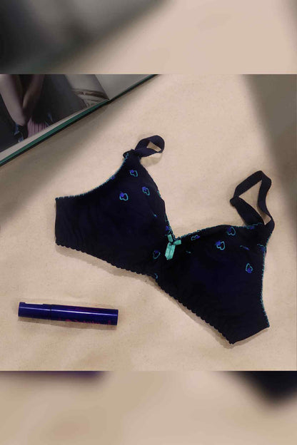 Navy blue patterned lingerie set: bra and matching underwear, flat lay