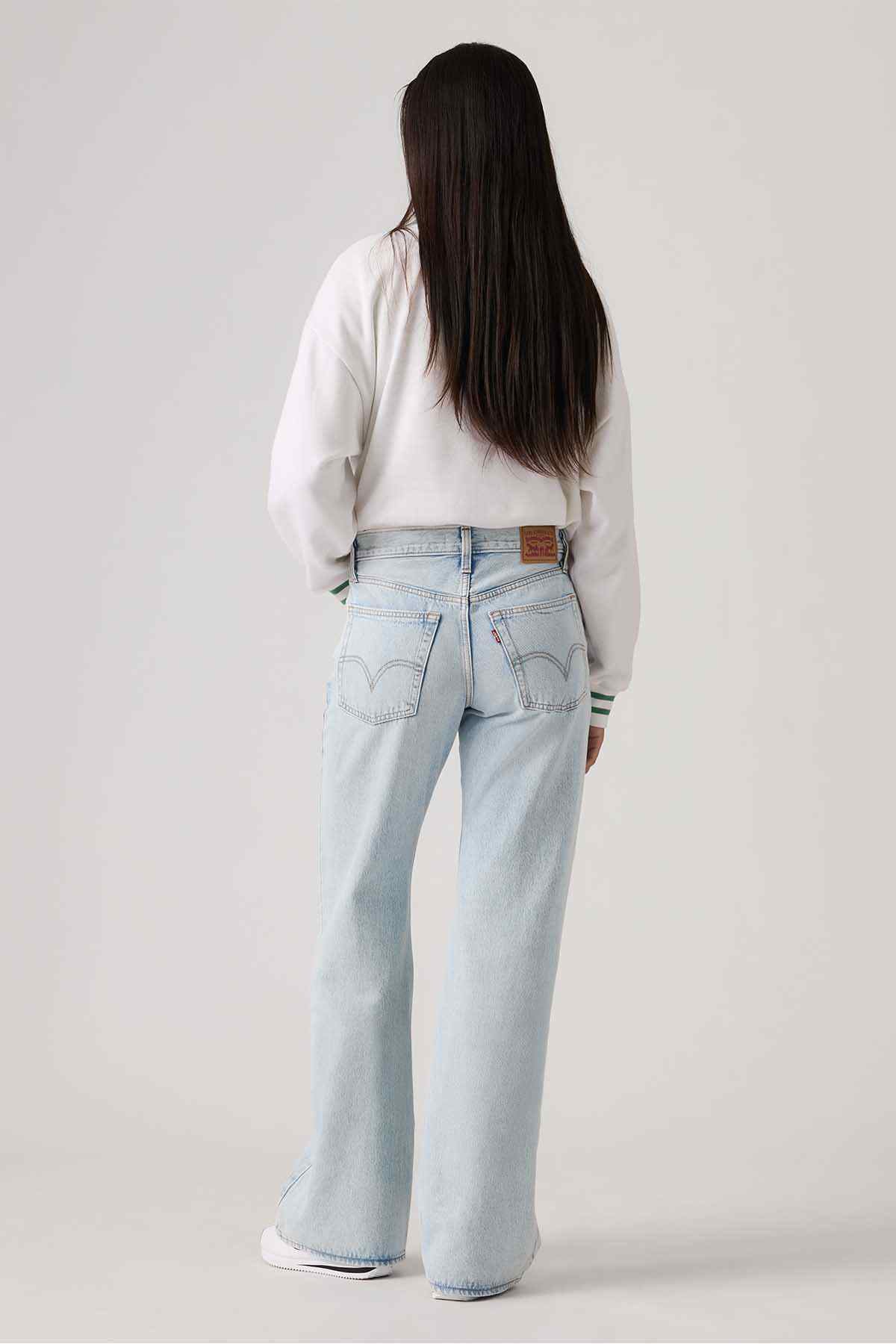 Levi's light indigo denim jeans, back view with stitched back pockets and yoke