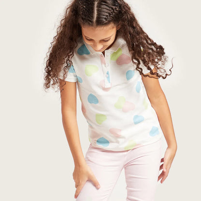Kids' short-sleeve polo shirt in cream with pastel cloud prints
