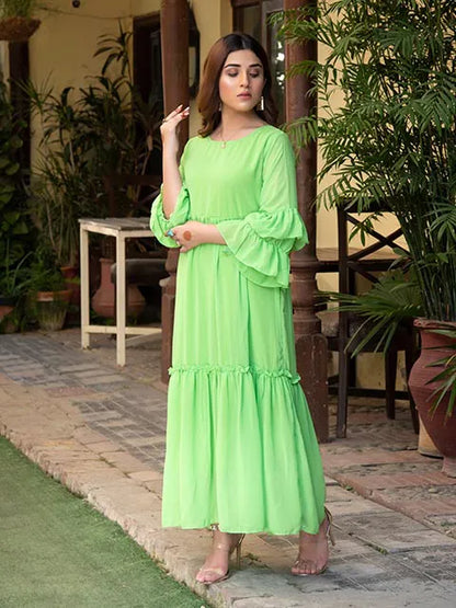 Green tiered midi dress with layered skirt tiers and wide ruffle cuffs