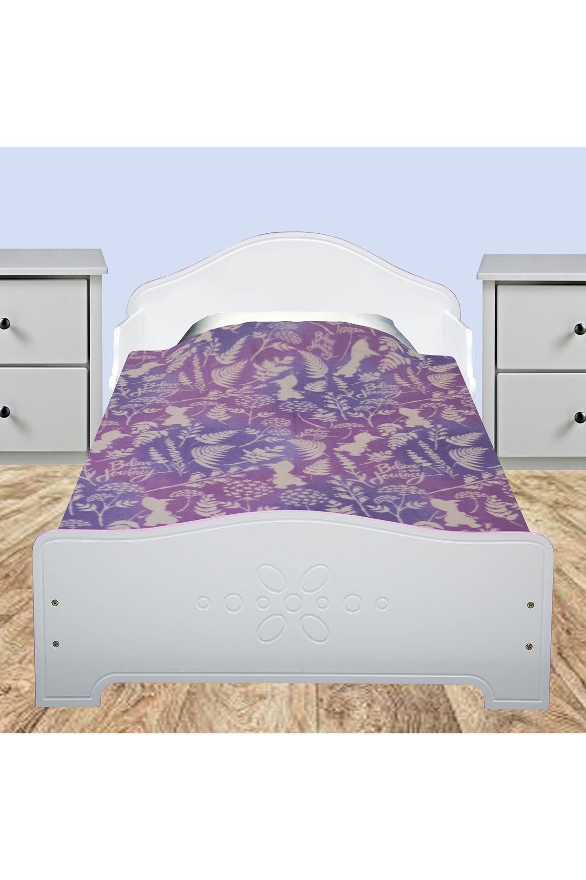 DISNEY purple blanket spread on toddler bed with floral and text pattern