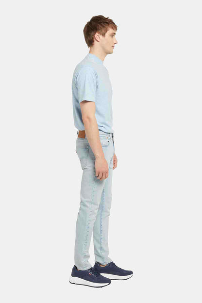 Light wash denim jeans, side view showing slight taper